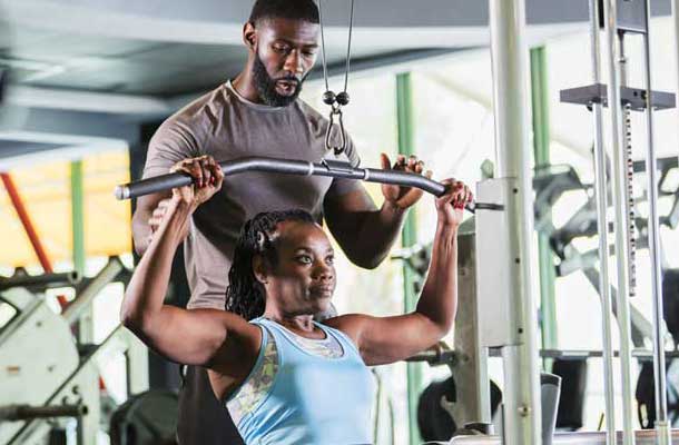 2 African Americans working on triceps